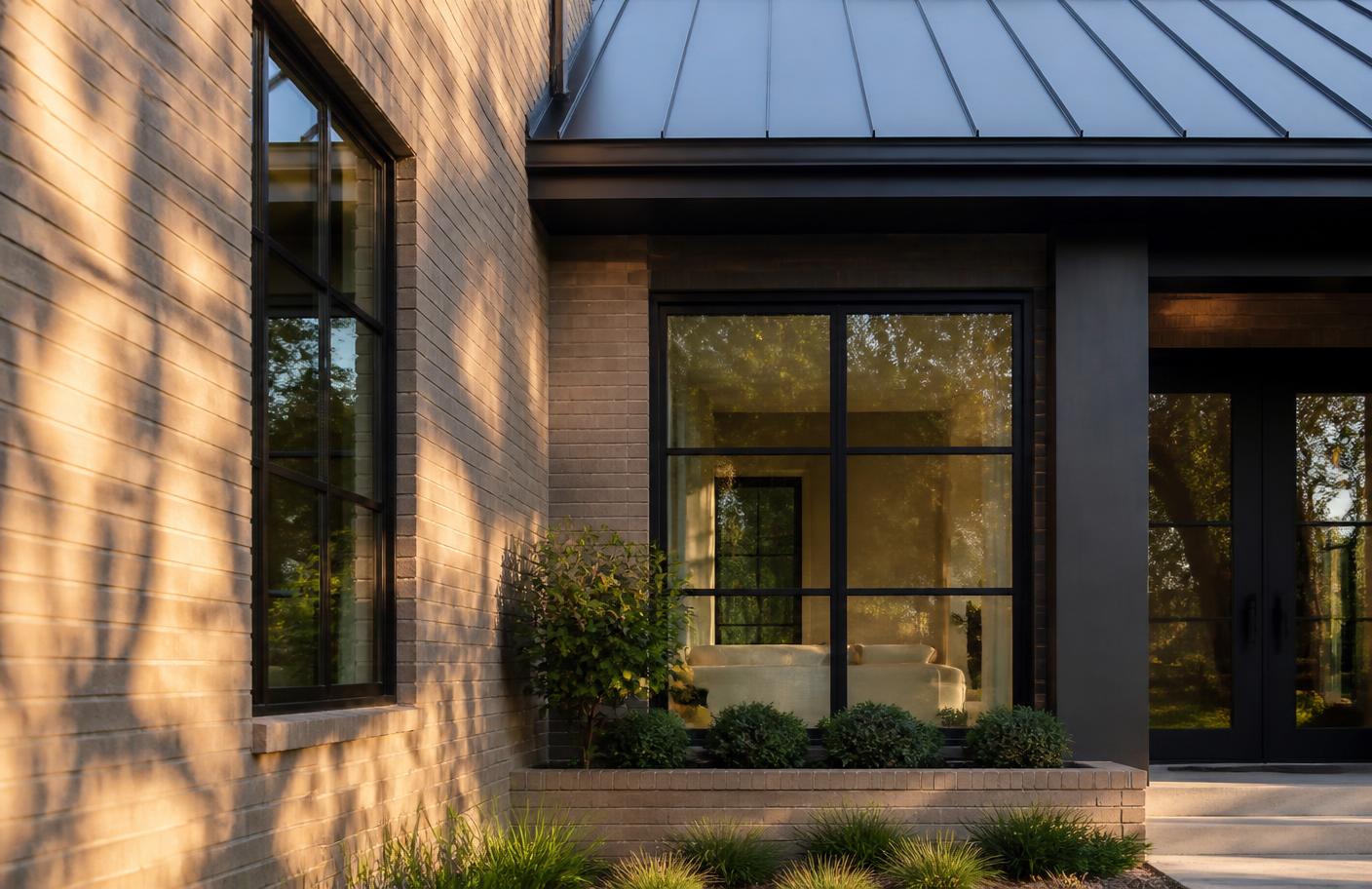 Modern brick home exterior detail in late afternoon light